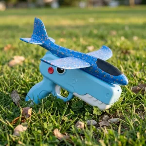 Giocattolo lanciatore di aeroplani in schiuma a forma di simpatico dinosauro per bambini